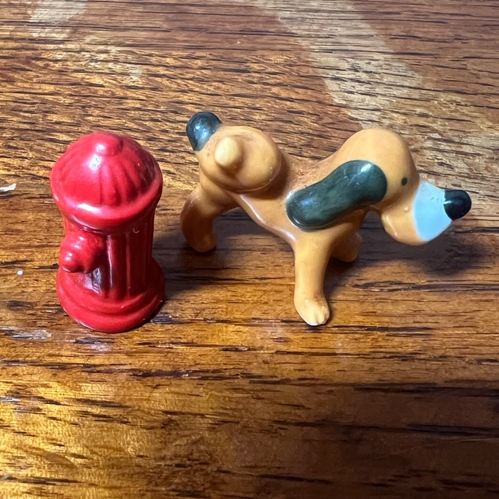 Hagen Renaker Ceramic Dog Figurine with Red Fire Hydrant